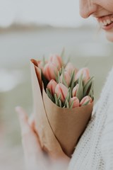 Woman_Holding_Bouquet_of_Tulips_for_Mothers_Day